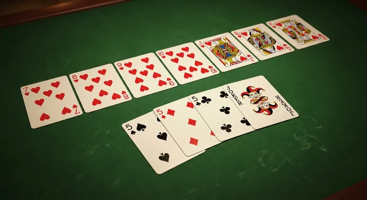 The goal of Contract Rummy: a finished hand arranged into valid melds