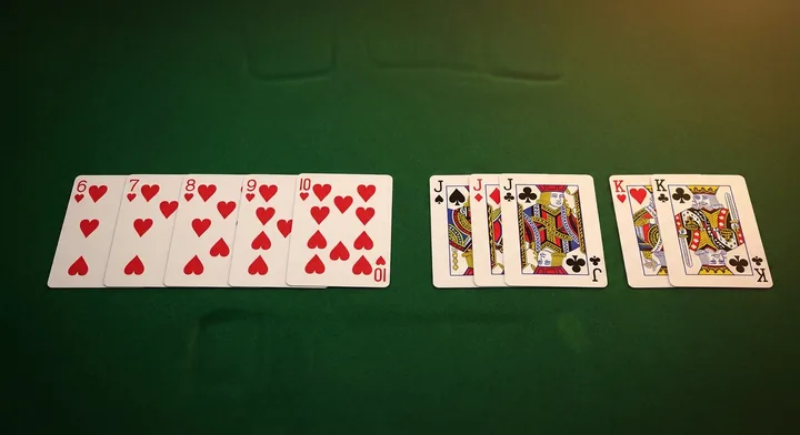 The goal of Straight Gin: a finished hand arranged into valid melds